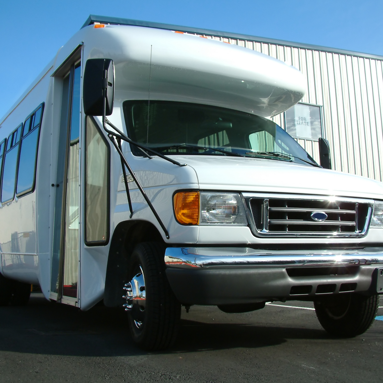 Small white transport bus